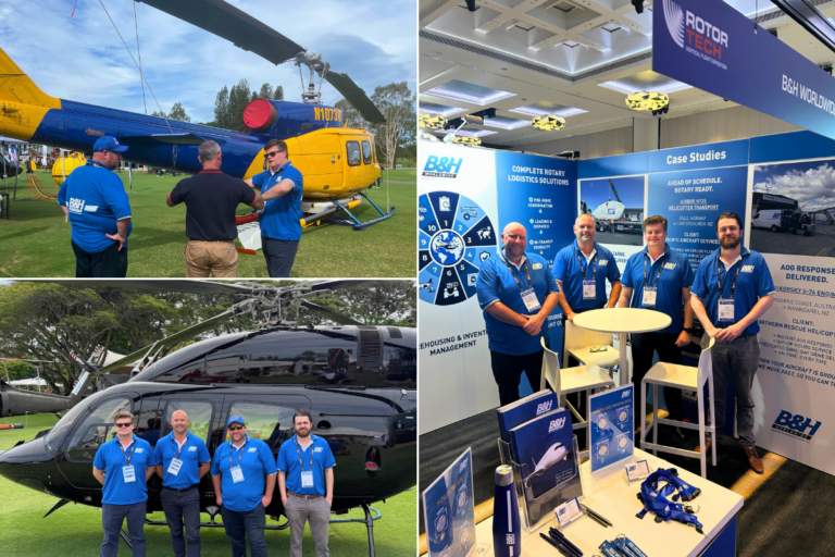 B&H Worldwide team at aviation event with helicopters and booth display.